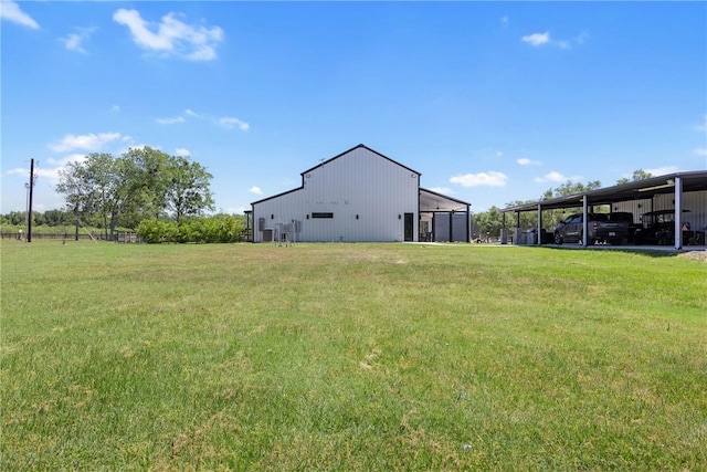 1923 County Road 202, Caldwell, TX 77836 - view of green lawn with a carport and an outbuilding