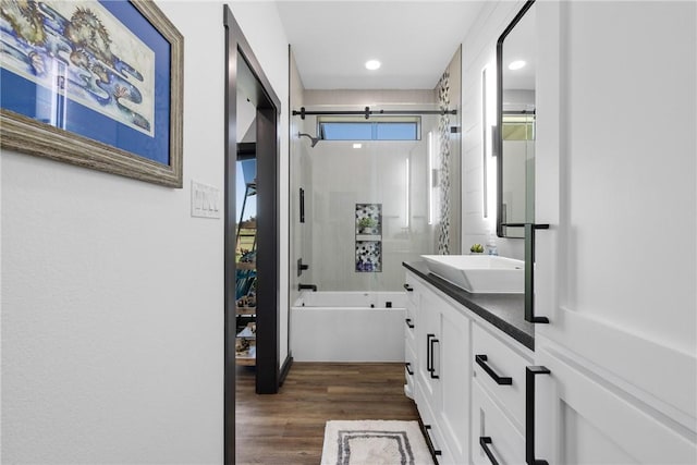 1923 County Road 202, Caldwell, TX 77836 - bathroom featuring vanity, wood finished floors, enclosed tub / shower combo, and recessed lighting