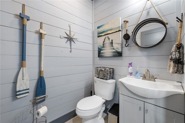 1923 County Road 202, Caldwell, TX 77836 - bathroom with vanity, toilet, and wood walls