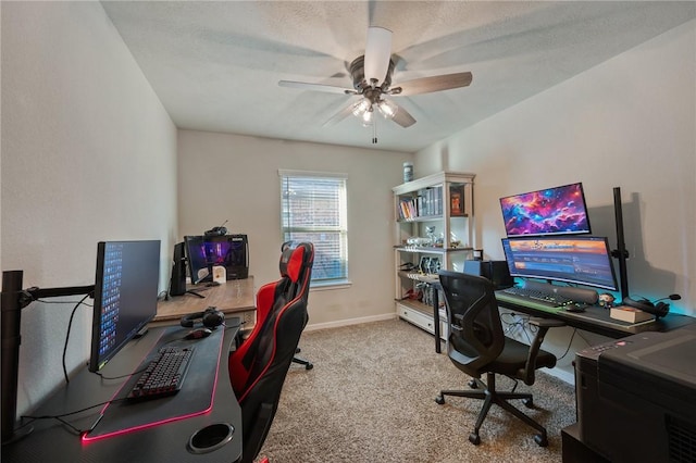 carpeted office with ceiling fan and a textured ceiling