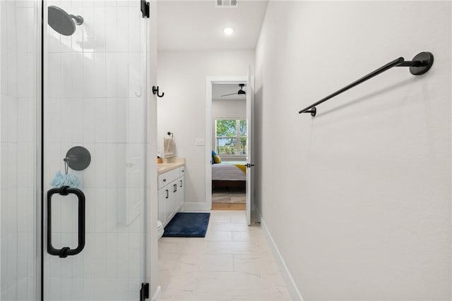 full bath featuring a shower stall, marble finish floor, baseboards, and ensuite bathroom