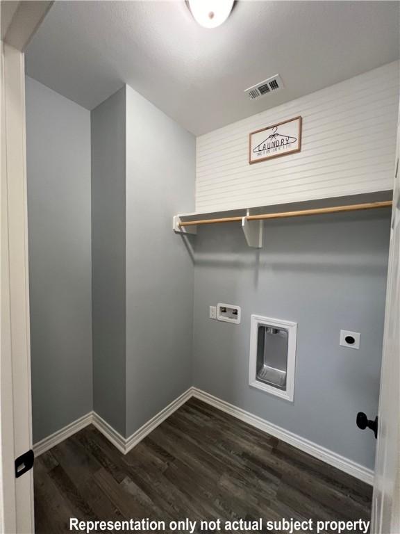 washroom with electric dryer hookup, hookup for a washing machine, and dark hardwood / wood-style flooring