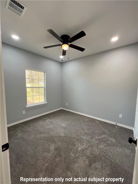 unfurnished room featuring ceiling fan and dark carpet