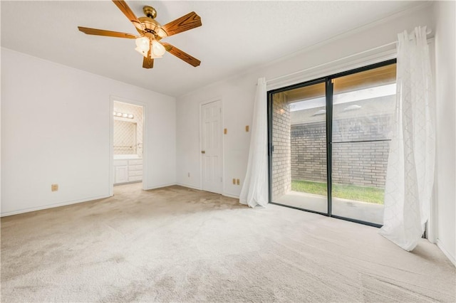 unfurnished bedroom with access to exterior, connected bathroom, light colored carpet, and ceiling fan