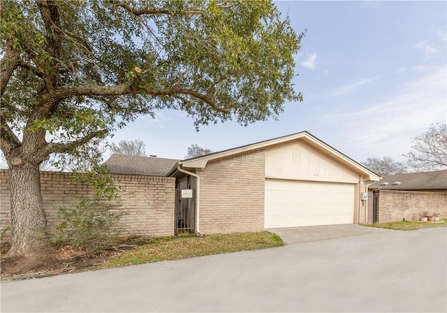 ranch-style home with a garage