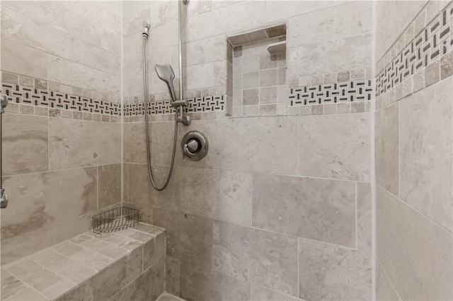 bathroom with a tile shower