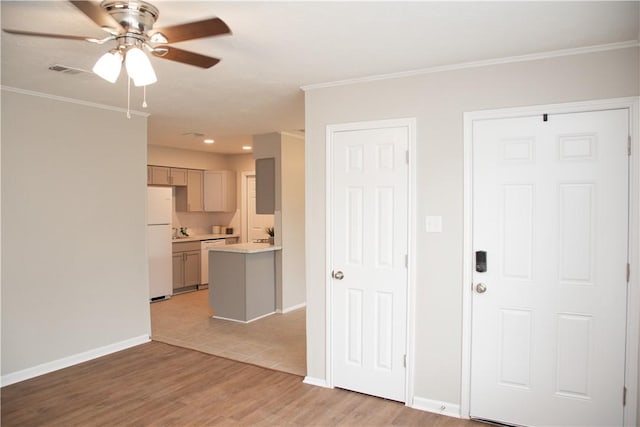 3023 Kim St, Bryan, TX 77803 - foyer entrance featuring ceiling fan, crown molding, light wood-type flooring, baseboards, and recessed lighting
