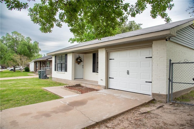 3023 Kim St, Bryan, TX 77803 - ranch-style home featuring brick siding, driveway, and an attached garage