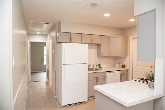 3023 Kim St, Bryan, TX 77803 - kitchen featuring white appliances, gray cabinetry, light countertops, a sink, and recessed lighting