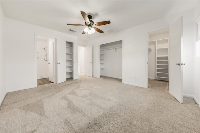 unfurnished bedroom featuring ceiling fan, light carpet, and connected bathroom