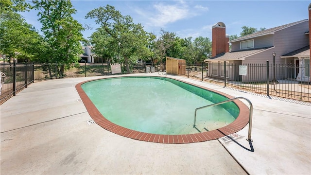 view of swimming pool with a patio area