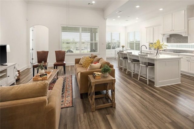 1932 Sherrill Ct, College Station, TX 77845 - living room featuring arched walkways, dark wood-type flooring, baseboards, and recessed lighting