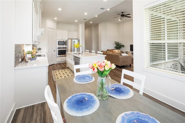 1932 Sherrill Ct, College Station, TX 77845 - dining space with dark wood-style floors, ceiling fan, baseboards, crown molding, and recessed lighting