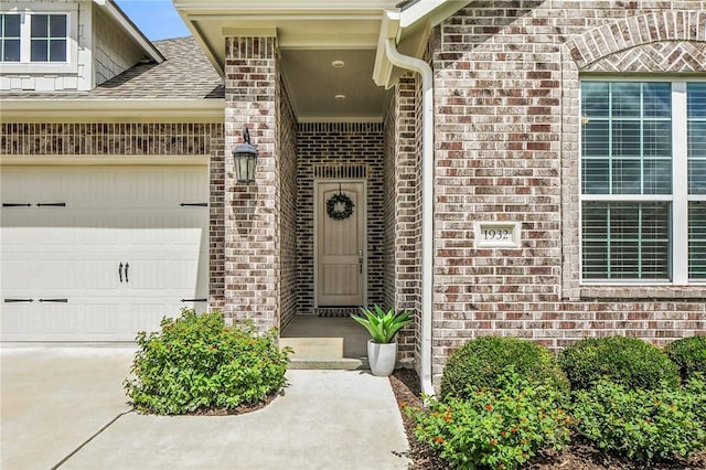 1932 Sherrill Ct, College Station, TX 77845 - entrance to property featuring brick siding, a garage, and roof with shingles