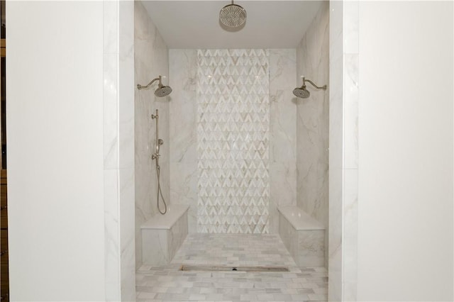 bathroom featuring a tile shower