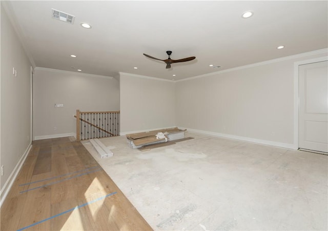 unfurnished room featuring ceiling fan and crown molding