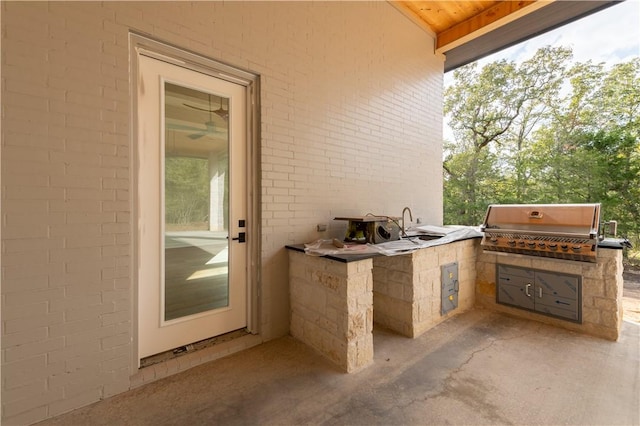 view of patio featuring an outdoor kitchen and area for grilling