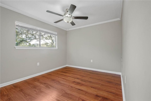 empty room with ceiling fan, wood-type flooring, and ornamental molding