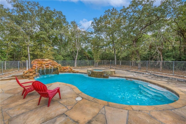 view of swimming pool with a patio area, an in ground hot tub, and pool water feature