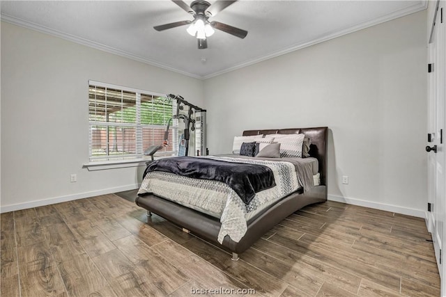 bedroom with hardwood / wood-style flooring, ceiling fan, and crown molding