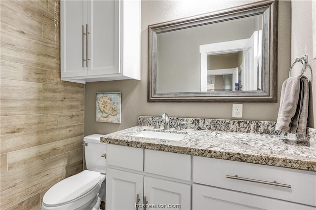 bathroom with vanity and toilet