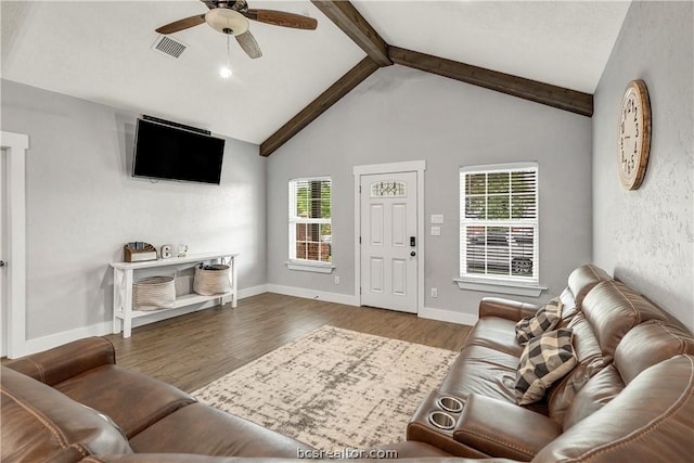 living room featuring plenty of natural light, ceiling fan, and light wood-type flooring