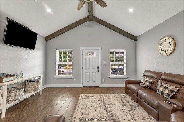 living room featuring beamed ceiling, wood-type flooring, high vaulted ceiling, and ceiling fan