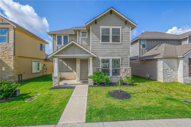 808 Mineral Wells Ln, College Station, TX 77845 - craftsman inspired home featuring board and batten siding, a front yard, and stone siding