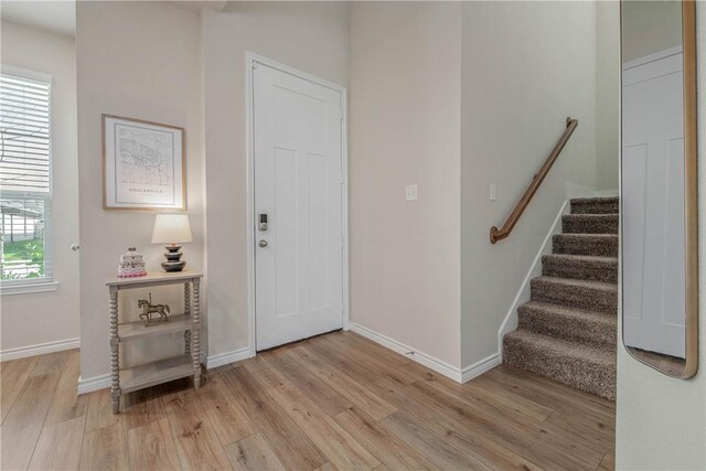 808 Mineral Wells Ln, College Station, TX 77845 - foyer with light wood-style flooring and stairs