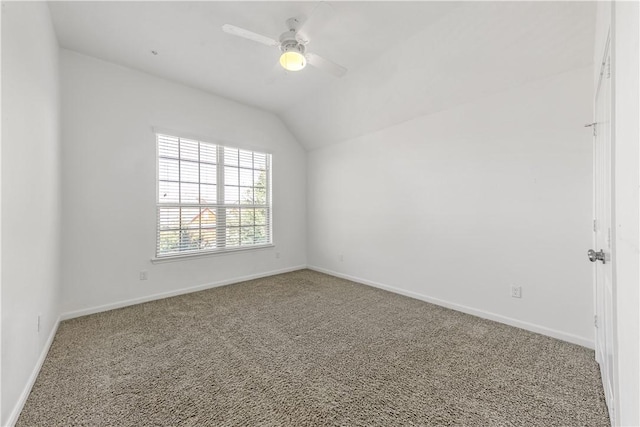 unfurnished room with lofted ceiling, ceiling fan, and carpet flooring