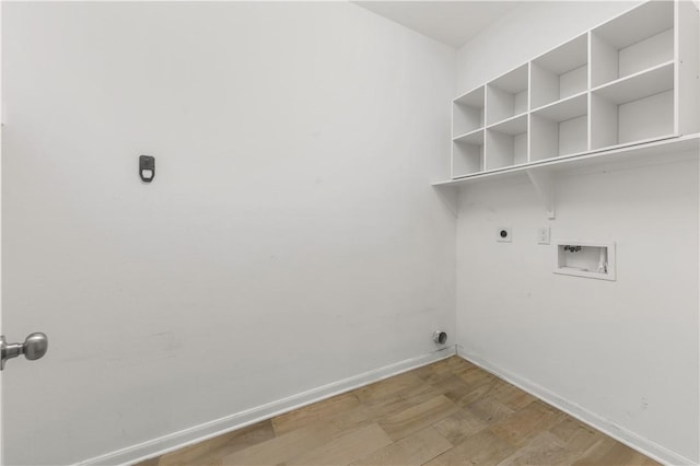 laundry area with light wood-type flooring, hookup for a washing machine, and electric dryer hookup