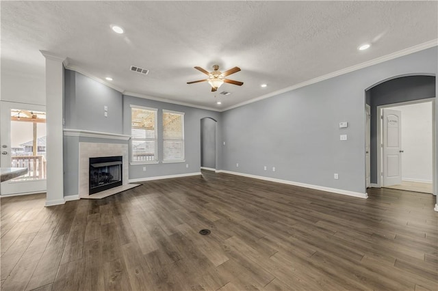 unfurnished living room with dark hardwood / wood-style floors, a fireplace, and a wealth of natural light