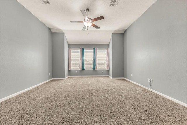 unfurnished room with ceiling fan, lofted ceiling, and carpet flooring