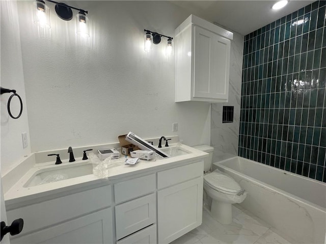 full bathroom with marble finish floor, a sink, toilet, and double vanity