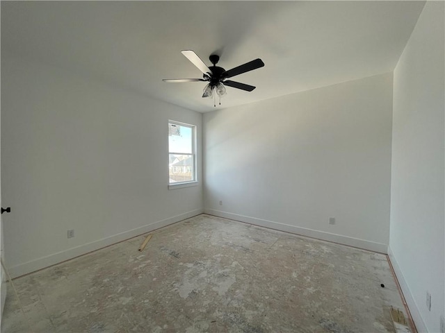 unfurnished room with baseboards and a ceiling fan