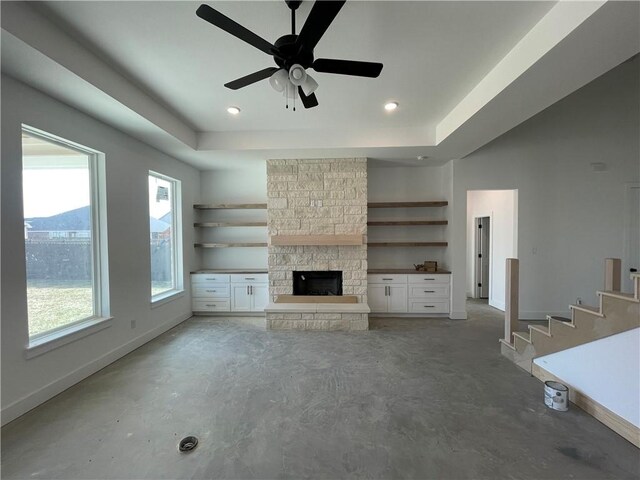 kitchen featuring a sink, visible vents, white cabinetry, a large island, and decorative backsplash