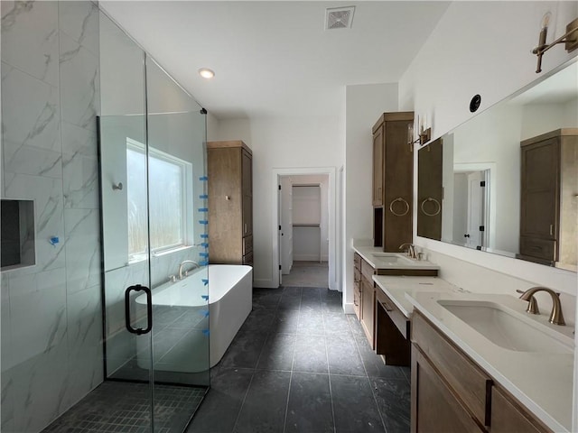 full bath featuring a soaking tub, a sink, visible vents, and a shower stall