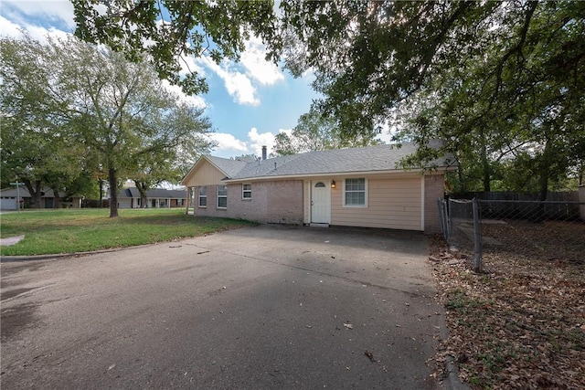 rear view of house with a yard