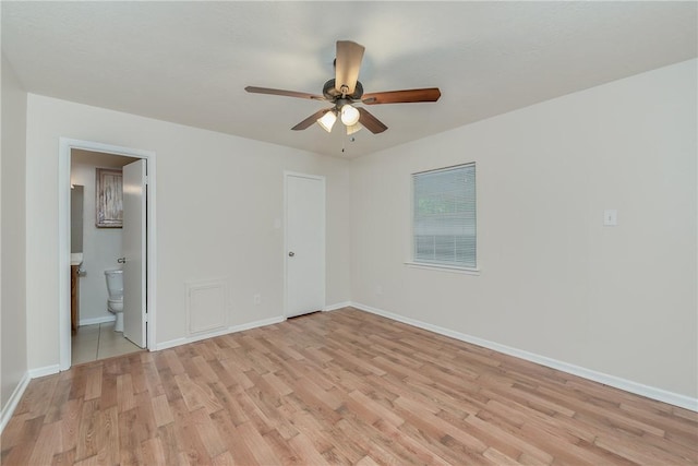 empty room with ceiling fan and light wood-type flooring