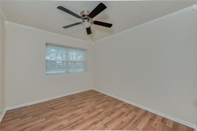 empty room with ceiling fan, crown molding, and light hardwood / wood-style flooring