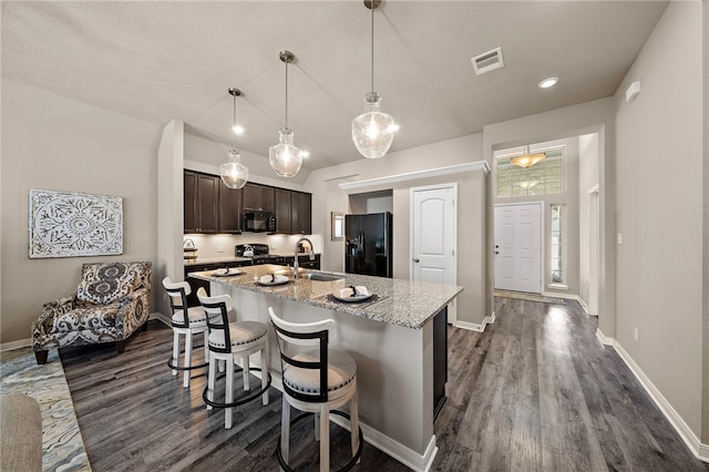 3860 Still Creek Loop, College Station, TX 77845 - kitchen with black appliances, a sink, dark wood-style floors, dark brown cabinetry, and recessed lighting