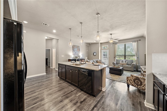 3860 Still Creek Loop, College Station, TX 77845 - kitchen with black appliances, a sink, open floor plan, dark wood-style flooring, and a ceiling fan