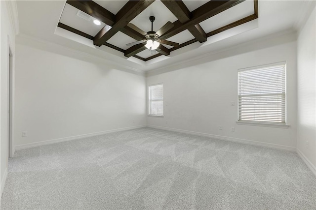 spare room with coffered ceiling, a ceiling fan, light colored carpet, beamed ceiling, and baseboards