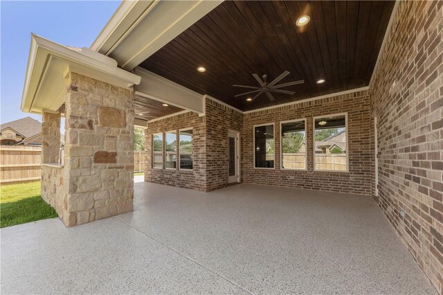 view of patio / terrace featuring a ceiling fan and fence