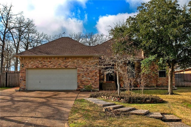 single story home featuring a garage and a front lawn