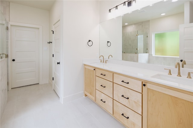2802 Spector Dr, Bryan, TX 77808 - bathroom with a shower stall, double vanity, baseboards, and tile patterned flooring