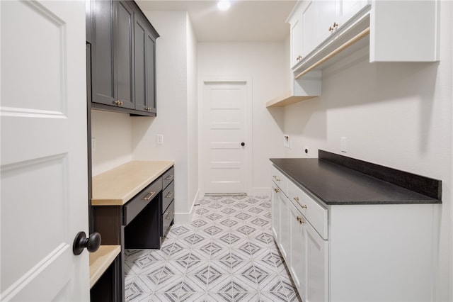2802 Spector Dr, Bryan, TX 77808 - washroom featuring hookup for an electric dryer, cabinet space, and baseboards
