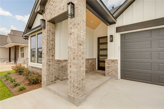 2802 Spector Dr, Bryan, TX 77808 - entrance to property with board and batten siding, driveway, a garage, and stone siding