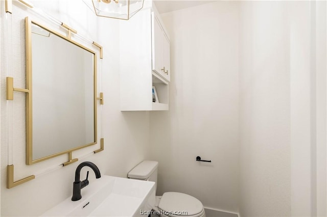 bathroom with toilet and sink