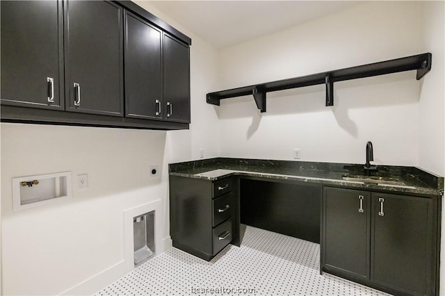 clothes washing area with cabinets, hookup for a washing machine, electric dryer hookup, and sink